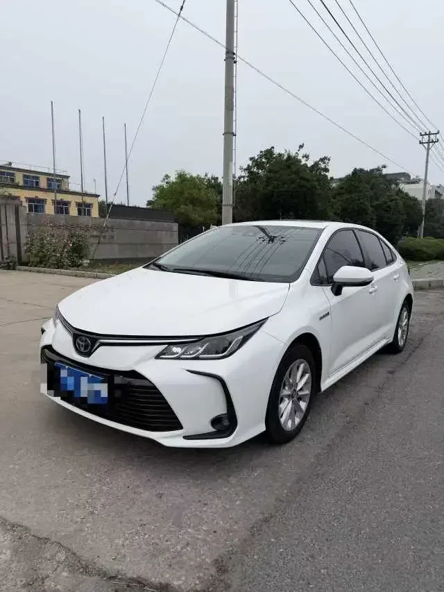 Toyota Corolla Corolla 2021 Dual Engine 1.8L E-CVT Elite Edition 2023 — photo 1, buy with delivery to Moscow