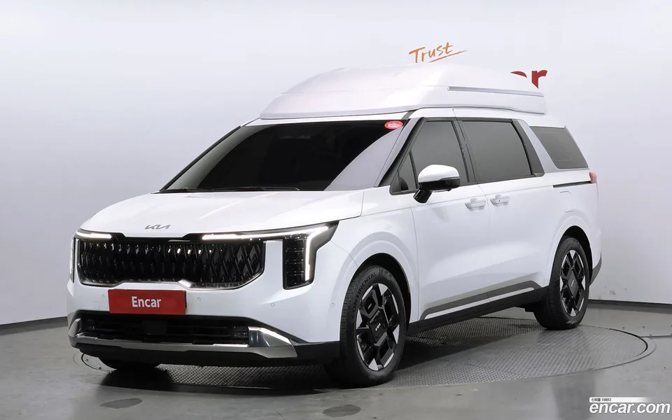 Kia Carnival HEV 7 2024 — фото 1, купить с доставкой в Москву