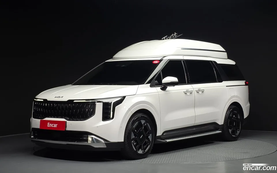 Kia Carnival HEV 7 2024 — photo 1, buy with delivery to Moscow