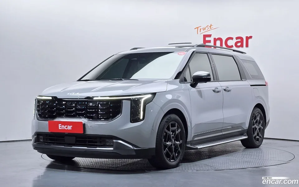 Kia Carnival HEV 7 2024 — photo 1, buy with delivery to Moscow