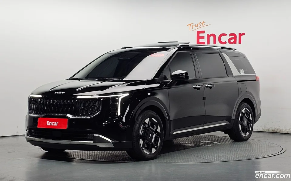Kia Carnival HEV 7 2024 — photo 1, buy with delivery to Moscow
