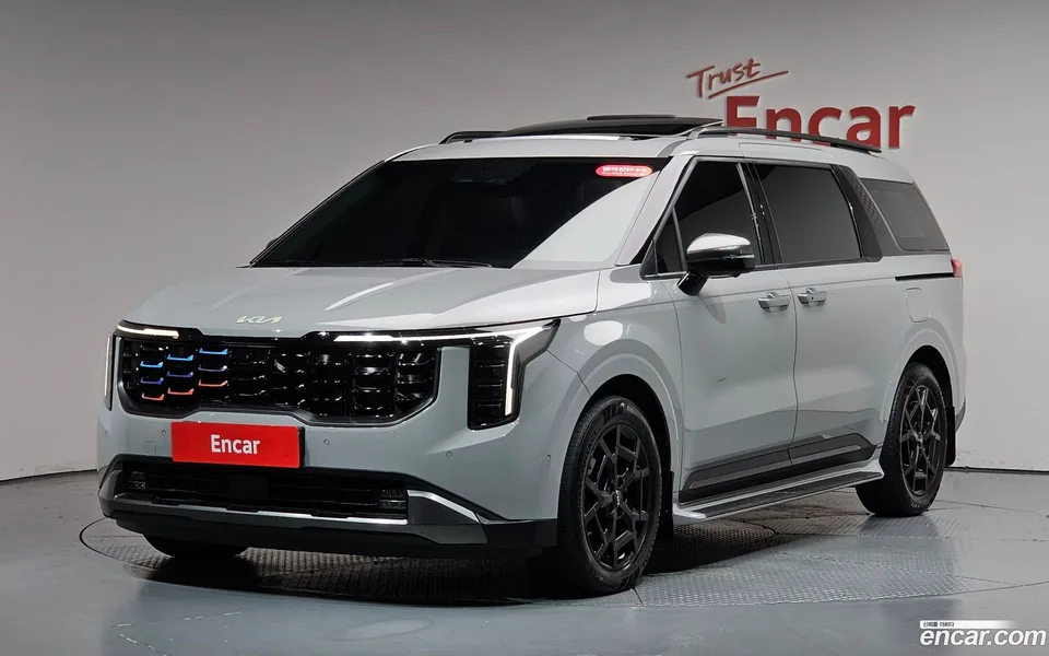 Kia Carnival HEV 7 2024 — photo 1, buy with delivery to Moscow