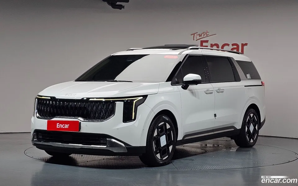 Kia Carnival HEV 7 2024 — photo 1, buy with delivery to Moscow