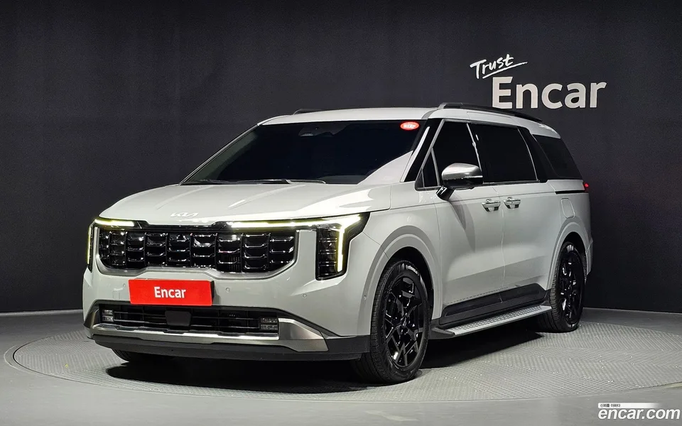 Kia Carnival HEV 7 2024 — photo 1, buy with delivery to Moscow