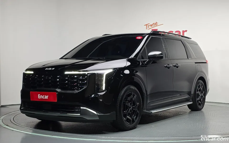 Kia Carnival HEV 7 2024 — photo 1, buy with delivery to Moscow