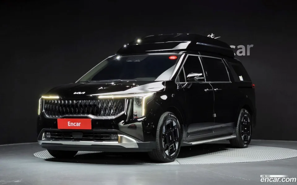 Kia Carnival HEV 7 2024 — photo 1, buy with delivery to Moscow