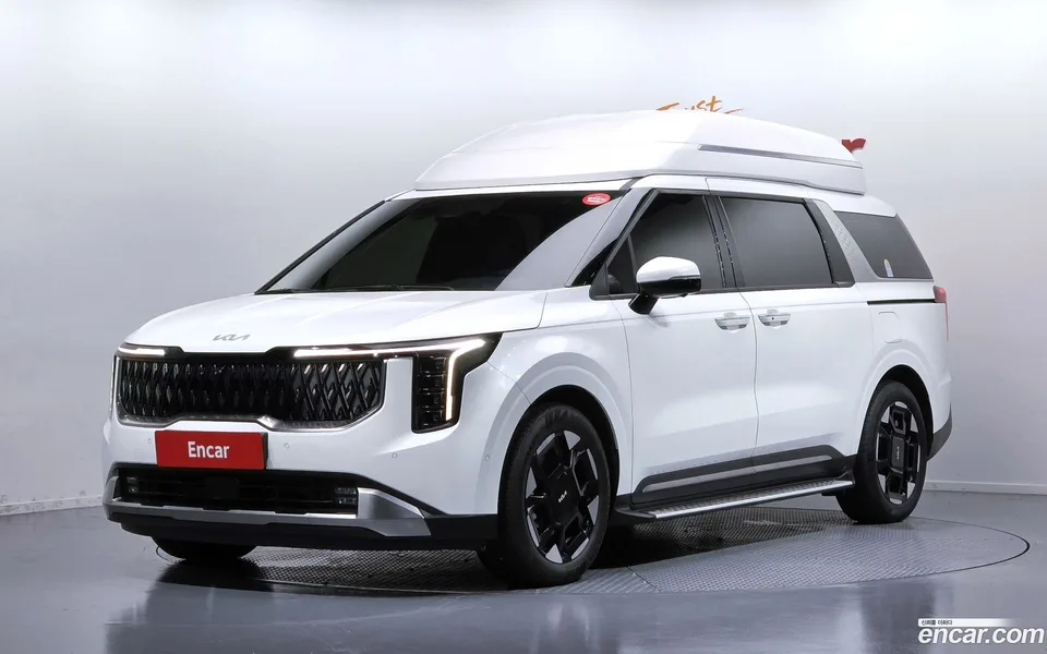 Kia Carnival HEV 7 2024 — photo 1, buy with delivery to Moscow