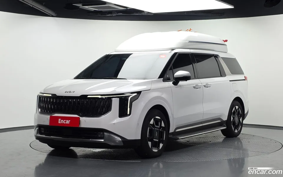 Kia Carnival HEV 7 2024 — photo 1, buy with delivery to Moscow