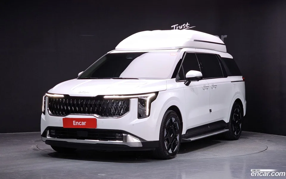 Kia Carnival HEV 7 2024 — photo 1, buy with delivery to Moscow