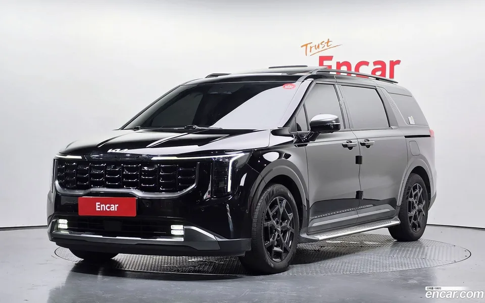 Kia Carnival HEV 7 2024 — photo 1, buy with delivery to Moscow