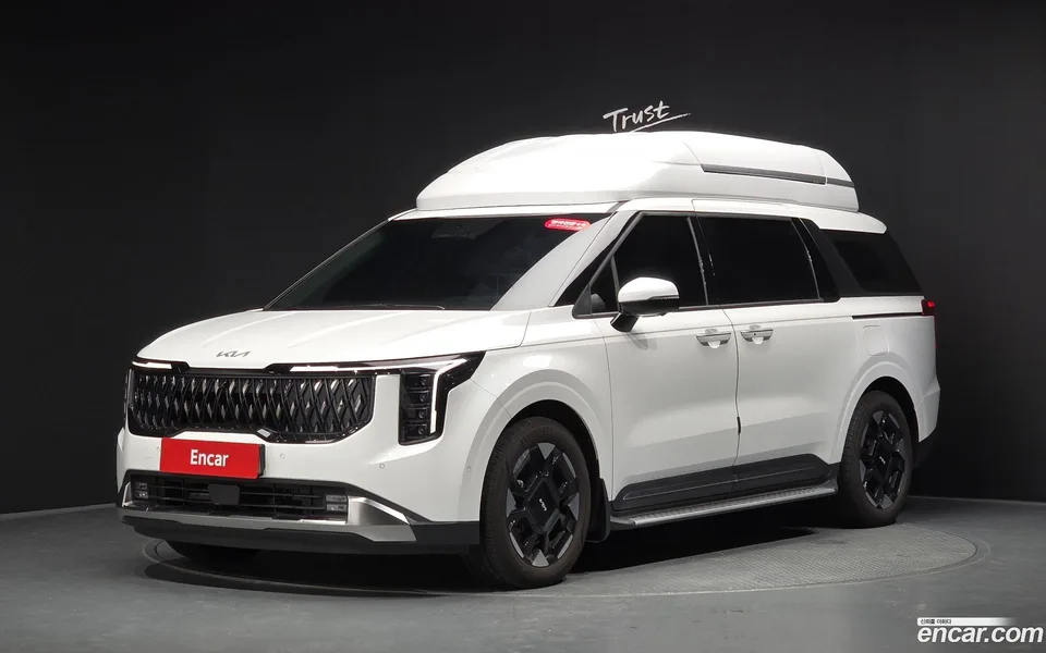 Kia Carnival HEV 7 2024 — photo 1, buy with delivery to Moscow