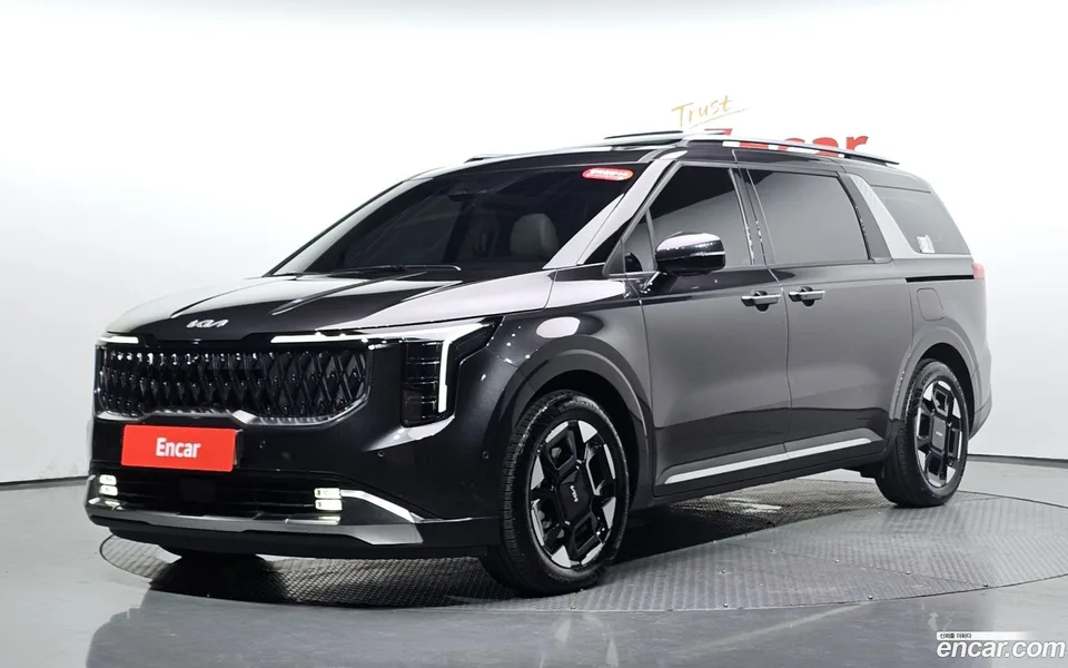 Kia Carnival HEV 7 2024 — photo 1, buy with delivery to Moscow