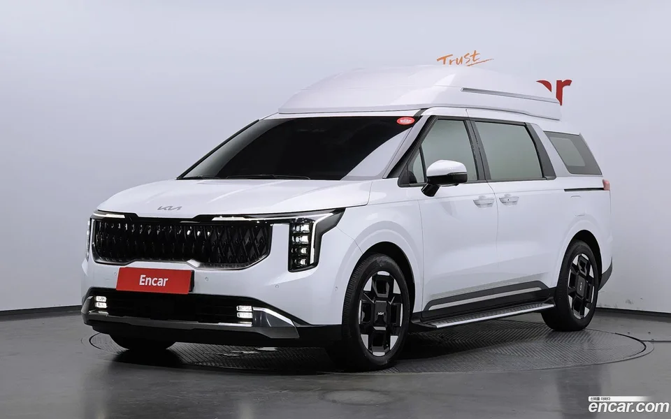 Kia Carnival HEV 7 2024 — photo 1, buy with delivery to Moscow